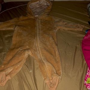 A Lilly$Dan onesie, Tan brown,says 12M but can fit from 6M-12M
